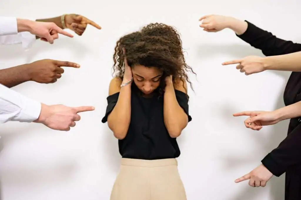 Women with people shouting