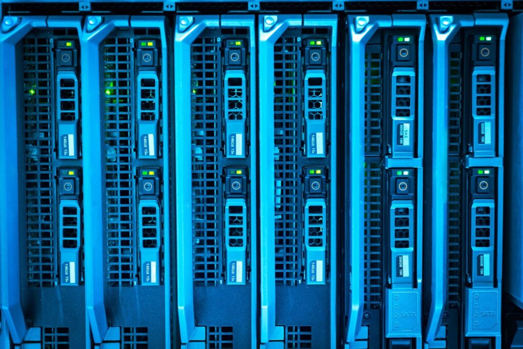 Server box lit up in blue in a data center
