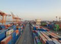 Colorful cargo containers at a harbor at sunrise, like the app bundles you use when you install Docker on Ubuntu