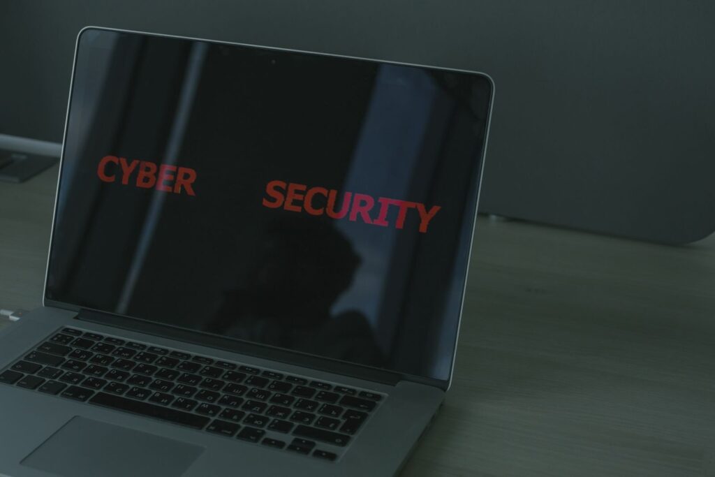 Close-up of a laptop screen with security text