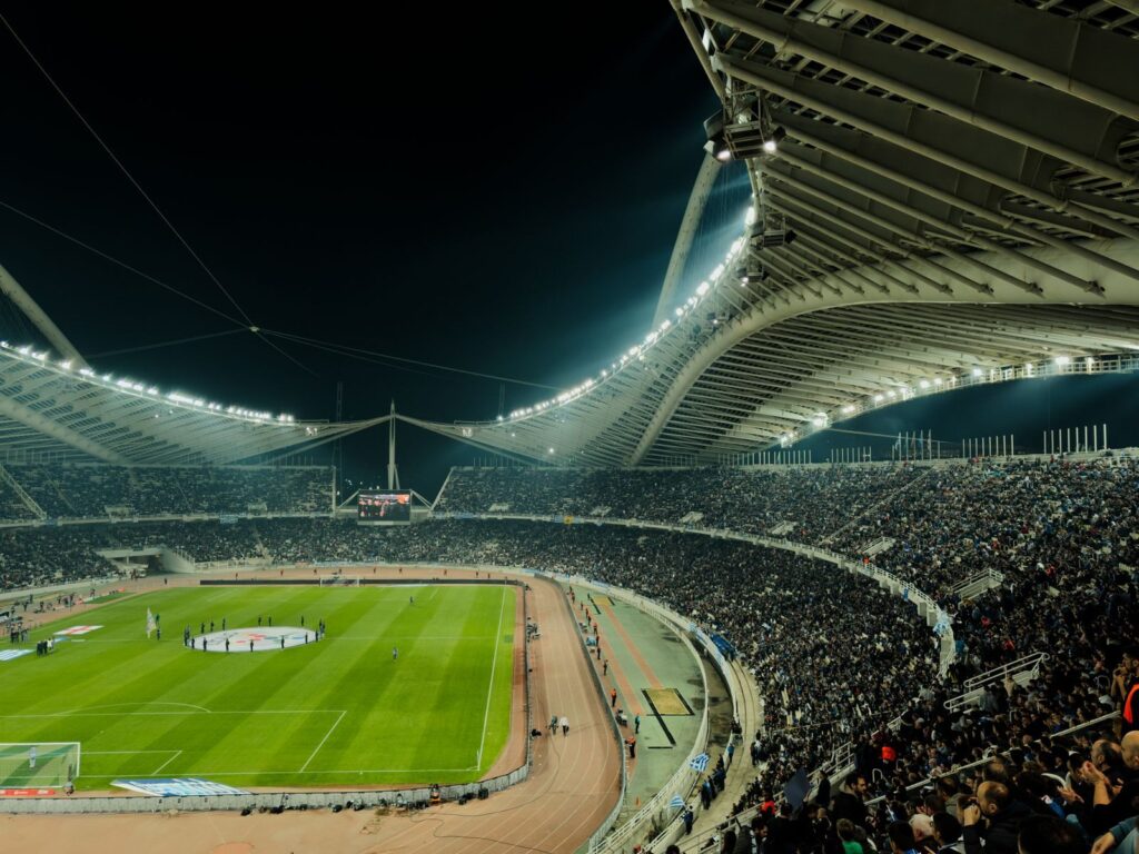 Floodlit stadium crowd at night, the kind of scene fans hope for at Rugby League World Cup 2026